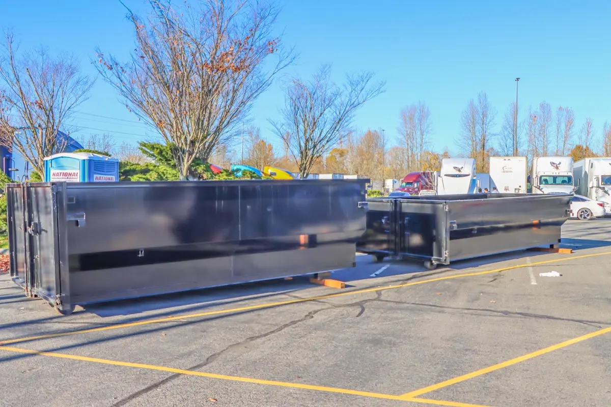 Professional dumpster rental service with roll-off container on residential driveway in Chesterfield